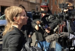 Chelsea Manning addresses the media outside federal court in Alexandria, Va., March 5, 2019.