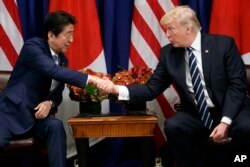 President Donald Trump shakes hands with Japanese Prime Minister Shinzo Abe during a meeting at the Palace Hotel during the United Nations General Assembly, Thursday, Sept. 21, 2017, in New York.