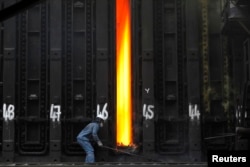 FILE - A man works at Turkish steel manufacturer ISDEMIR's plant in Iskenderun in Hatay province, Turkey.
