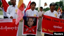 FILE - People demonstrate against Time magazine in Yangon June 30, 2013 when its cover story dubbed radical Buddhist monk U Wirathu, "The Face of Buddhist Terror".