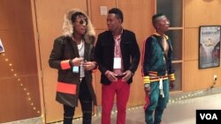 Haitian rappers Dasmain, left and Gino Love, right talk to a Haitian journalist before the premiere. (S. Lemaire/VOA)