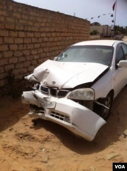 Another cellphone picture shows a car smashed and shot at. Ahmed says if he goes back he will be killed, July 8, 2016. (Photo: H. Murdock / VOA)