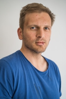 Radu Mocanu is seen in a photo taken after he and fellow crew members were attacked by unidentified assailants. (Courtesy: Greenpeace/Ioana Moldovan)