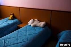 Beds are made to welcome the children for an early afternoon sleep, before leaving for the weekend, at the Model National Nursery of Kallithea, in Athens, Greece, March 3, 2017.