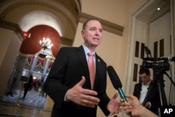 FILE - Rep. Adam Schiff, D-Calif., takes questions from reporters at the Capitol in Washington, May 10, 2018.