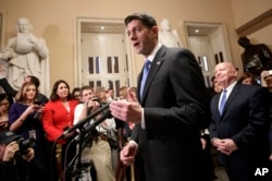 Speaker of the House Paul Ryan, R-Wis., joined at right by House Ways and Means Committee Chairman Kevin Brady, R-Texas, meets reporters just after passing the Republican tax reform bill in the House of Representatives, on Capitol Hill, in Washington, Dec. 19, 2017.