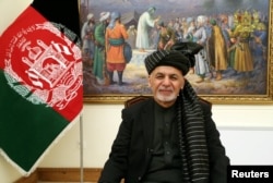 FILE - Afghanistan's President Ashraf Ghani speaks during a live TV broadcast at the presidential palace in Kabul, Afghanistan, Jan. 28, 2019.