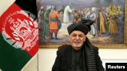 Afghanistan's President Ashraf Ghani speaks during a live TV broadcast at the presidential palace in Kabul, Afghanistan, Jan. 28, 2019.