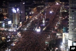Protesters occupy major streets in the city center for a rally against South Korean President Park Geun-hye in Seoul, South Korea, Saturday, Dec. 3, 2016.