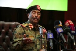Sudan's head of the military, Gen. Abdel-Fattah Burhan, speaks during a press conference at the General Command of the Armed Forces in Khartoum, Oct. 26, 2021.