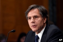 FILE - Deputy Secretary of State Antony Blinken says "there is a real risk that minority communities that lived and survived and even thrived together for centuries will vanish entirely from the region" where Islamic State has left paths of destruction.