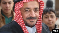 Sheikh Mohammad Abu Omar, a local leader in the village of Bashmana, says that before Hashd Shaabi captured their village, they feared sectarian violence from the predominantly Shia forces, but those fears have since been allayed Bashmana, Iraq, Dec. 16, 2016. (H. Murdock/VOA)