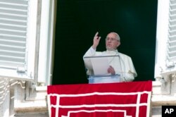 Pope Francis delivers his blessing to faithful during the Angelus noon prayer from his studio window overlooking St. Peter's Square at the Vatican, Sept. 6, 2015.