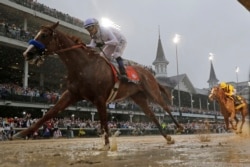 FILE - In this May 5, 2018 file photo, Mike Smith rides Justify to win the 144th Kentucky Derby in Louisville (AP Photo / Morry Gash, file)