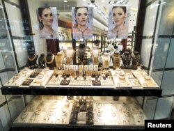Salesmen are seen in a gold shop in Gold Souq in Dubai, United Arab Emirates, Dec. 30, 2018.