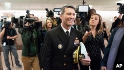Rear Adm. Ronny Jackson, President Donald Trump's choice to be secretary of the Department of Veterans Affairs, leaves a Senate office building after meeting individually with some members of the committee that would vet him for the post, on Capitol Hill