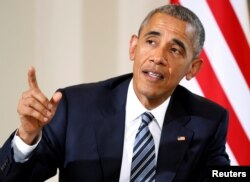 FILE - President Barack Obama answers a reporter's questions after meeting with Spain's acting Prime Minister Mariano Rajoy at the Palacio de la Moncloa in Madrid, Spain, July 10, 2016.