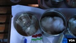 Medical equipment are used by health officials to conduct blood test for HIV infection to residents in Peam village, Kandal province, on Monday, Feb 22, 2016. (Photo: Aun Chhengpor/VOA Khmer)