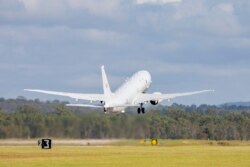 In this photo provided by the Australian Defense Force, a Royal Australian Air Force P-8 Poseidon aircraft departs an airbase in Amberly, Australia, Jan. 17, 2022, to assist the Tonga government after the eruption of an undersea volcano. (LACW Emma Schwenke / Australian Defence Force / AFP)