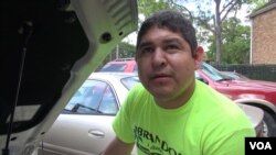 Omar Delfin says he and his wife and child will stay with relatives who live outside the flood zone to avoid exposure to health-threatening mildew and mold, which has already started growing in carpet and on walls in flooded apartments. (G. Flakus/VOA)