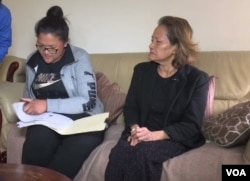 Kosal Chhim's wife, Sanghear Prak, with his mother, Mouy Krouch at their Stafford, Virginia home.