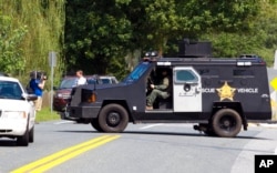 A Harford County Sheriff's vehicle blocks an entrance at the industrial business park, where several people had been shot, according with police reports in Aberdeen, Sept. 20, 2018.