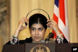 FILE - Former chair of Britain's Conservative party Sayeeda Warsi accuses EU opponents of 'hate and xenophobia'.