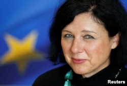 FILE - European Justice Commissioner Vera Jourova attends an interview with Reuters at the EU Commission headquarters in Brussels, Belgium, Sept. 11, 2017.