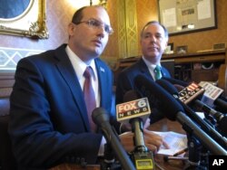 Rep. Jesse Kremer, left, speaks as Assembly Speaker Robin Vos listens at a news conference focused on targeting fraud in Wisconsin's food stamp program. Nov. 3, 2015, in Madison, Wisconsin.