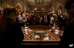 Ancient Egyptian artifacts are displayed in glass cases during the opening of the exhibition entitled Tutankhamun's Unseen Treasures, Nov. 15, 2017.