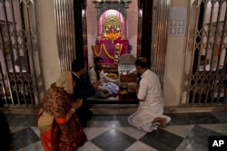 Hindu devotees pray at the Dhakeshwari Temple in Dhaka, Bangladesh, Jan. 1, 2019. Religious minorities in the Muslim-majority nation say Prime Minister Sheikh Hasina has safeguarded their rights.