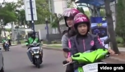 FILE - Indonesian service LadyJek provides a transportation alternative for women who feel more comfortable being driven by female bikers.
