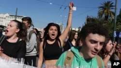 Students chant slogans as they protest during a 24-hour nationwide general strike in Athens, Nov. 12, 2015.