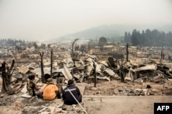 View of the remains of Santa Olga, 350 kilometres south of Santiago, after being devastated by a forest fire, Jan. 27, 2017.