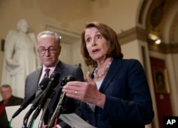 FILE - House Democratic Leader Nancy Pelosi of California and Senate Democratic Leader Chuck Schumer of New York speak to reporters on Capitol Hill in Washington, March, 13, 2017.