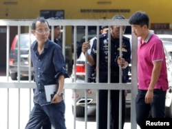 North Korea Embassy officials leave the morgue at Kuala Lumpur General Hospital where Kim Jong Nam's body is held for autopsy in Malaysia, Feb. 15, 2017.