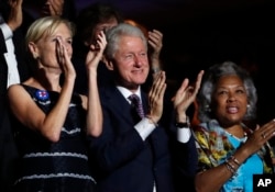 Former President Bill Clinton applauds Former Democratic Presidential candidate, Sen. Bernie Sanders, I-Vt., as he speaks during the first day of the Democratic National Convention in Philadelphia , Monday, July 25, 2016.