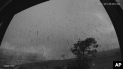 This May 17, 2018, image provided by the U.S. Geological Survey shows a view of the ash plume resulting from an early morning explosion at Kilauea Volcano, in Hawaii.