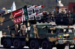 FILE - A Nasr missile is loaded on vehicle during the Pakistan National Day parade in Islamabad, Pakistan, March 23, 2015.