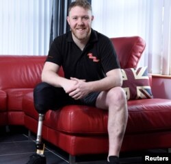Phillip Gillespie, who has received an invitation to the wedding of Britain's Prince Harry and Meghan Markle at Windsor Castle next month, poses for a portrait in Ballymena, Northern Ireland, April 10, 2018.