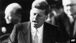 FILE - President John F. Kennedy delivers his inaugural address after taking the oath of office at the Capitol in Washington, D.C., Jan. 20, 1961.