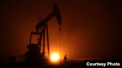 North Dakota plains are transformed by an oil boom. Credit: from "White Earth"/ J. Christian Jensen