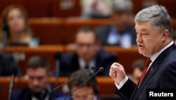 FILE - Ukraine's President Petro Poroshenko addresses the Parliamentary Assembly of the Council of Europe in Strasbourg, France, Oct. 11, 2017.