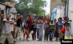 FILE - Residents chant slogans against Congolese President Joseph Kabila during demonstrations in the streets of the Democratic Republic of Congo's capital Kinshasa, Dec. 20, 2016.