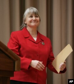 FILE - Gail Kimbell, then the new chief of the U.S. Forest Service, takes part in a ceremony at the Agriculture Department in Washington, Jan. 12, 2007.