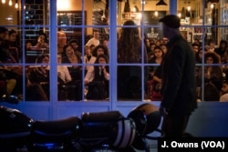 A man strolls past a storytelling event, one of many to spring up in Beirut over the past two years.