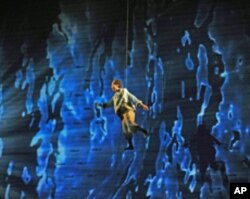 Soprano Talise Trevigne as 'Pip' treading water after being lost at sea in the only role for a woman's voice in the opera.