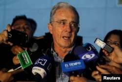 Former Colombian president Alvaro Uribe talks to the media after a meeting with Colombia President Juan Manuel Santos over a new peace deal with FARC, Nov. 12, 2016. Uribe is very much against the accord.