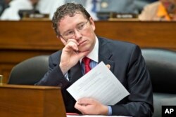 FILE - Rep. Thomas Massie, R-Ky. listens during a hearing on Capitol Hill in Washington, June 28, 2013. Massie said a recent presentation by GOP leaders aimed at convincing lawmakers that they were aligned with President Donald Trump on a pending health care bill was a failure.