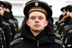 FILE - Russian Black Sea fleet sailors take part in a military parade in Sevastopol, Crimea, on March 18, 2015.